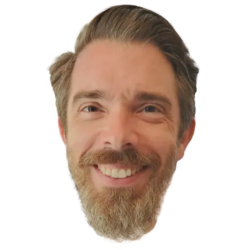 Photo of Ian Stevens smiling on a blue background